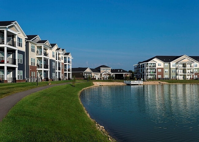 Amenities include a 6-acre lake, fishing deck, and walking trail.