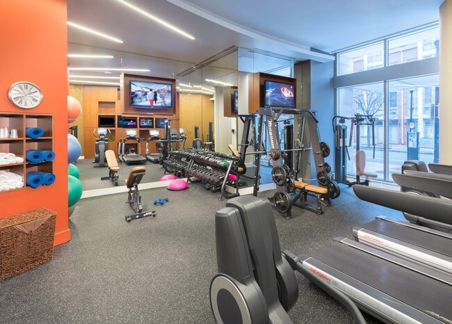 Fully-equipped fitness room with Pelotons