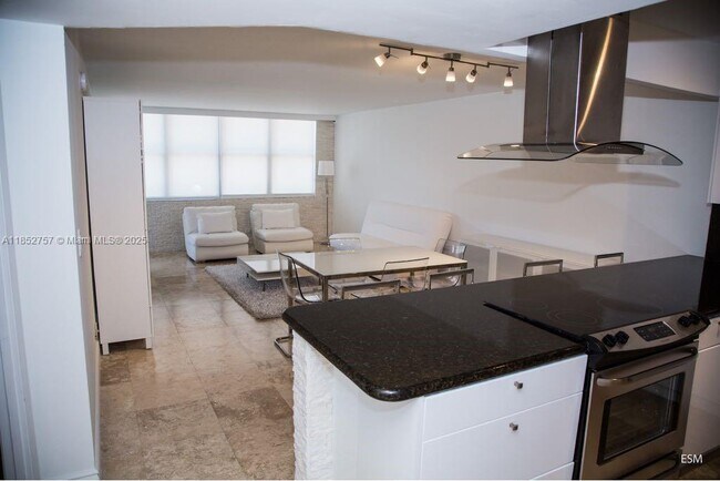 Building Photo - 6039 Collins Ave Unit 409 Rental