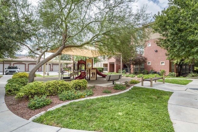Enjoy a serene day amidst the playful charm of a playground, complete with cozy picnic tables for a delightful outdoor feast
