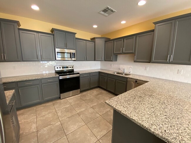 Photo - 3-Bed Home with Community Pool Access, Low-Maintenance Yard, and Upgraded Kitchen, Featuring Gran...