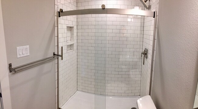 Updated walk-in shower with rain shower head - 3440 Willowrun Drive Unit C