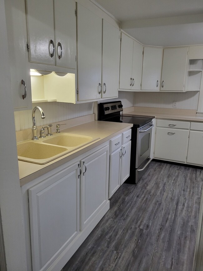 Kitchen view showing range - 61 W Main St Apartments Unit 2
