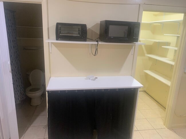 Counter with portable stove - 2721 SW 8th St Unit 1a