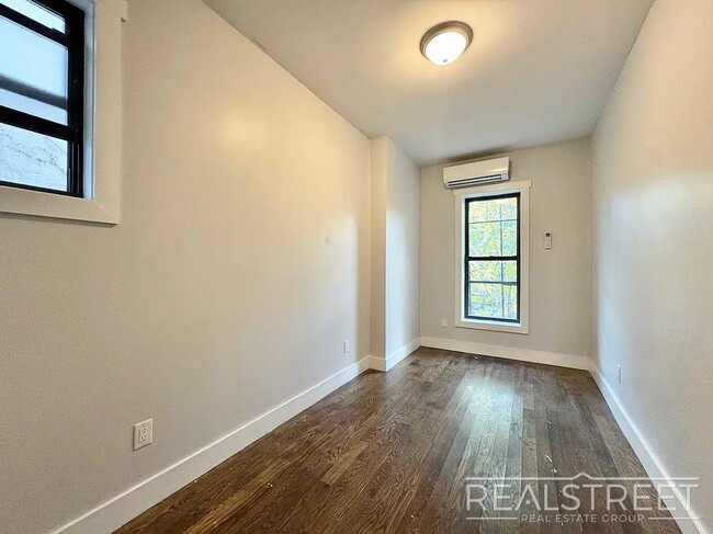 Photo - True 3 Bedroom layout — no flex, no railroad - Massive full-floor basement with second private entra Unit 2L
