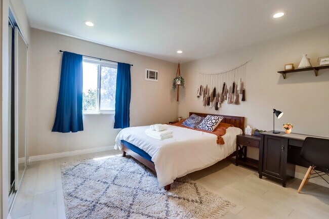 Recharge in this cloud-like queen bed in Bedroom 2 w/ a nearby workspace