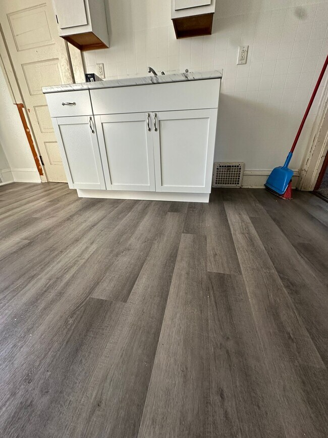 New kitchen floor and cabs - 831 Georgia Ave Apartments Unit UPPER