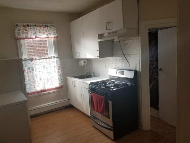 Kitchen, door on the right goes into bathroom.