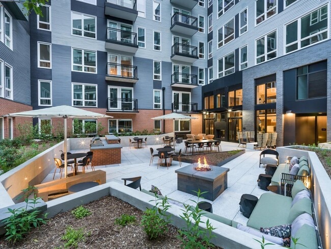 Make the most of every moment in our social courtyard—complete with fire pits, grilling stations, and cozy lounge seating for gathering day or night. - Modera H Street