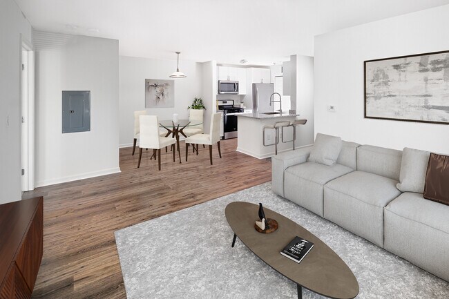 Phase I Renovated Package I apartment living and dining area with hard surface flooring