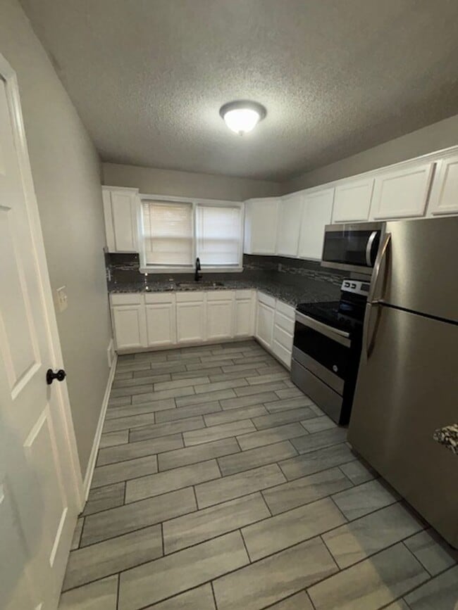 Photo - Charming 3 Bed, 1 Bath Home with 1-Car Garage in South Kansas City Location