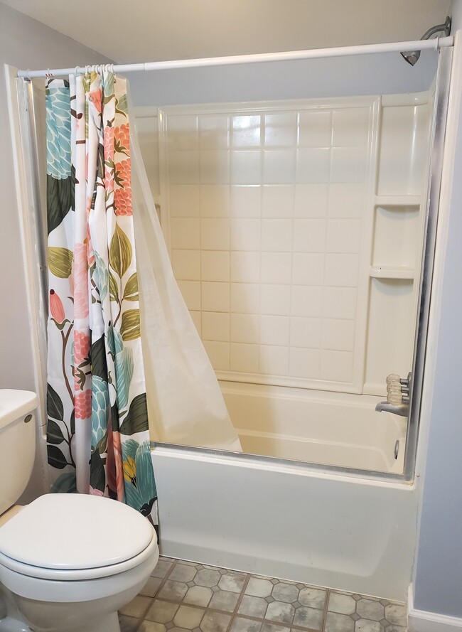 Bathroom with tub - 9829 Liberty Rd Unit $700/ month/ Room