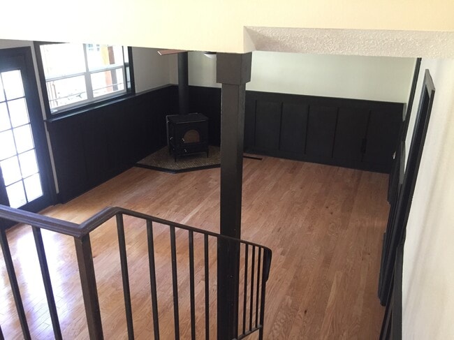 Sunken living room with woodstove and french doors out to patio - 8514 41st St W House