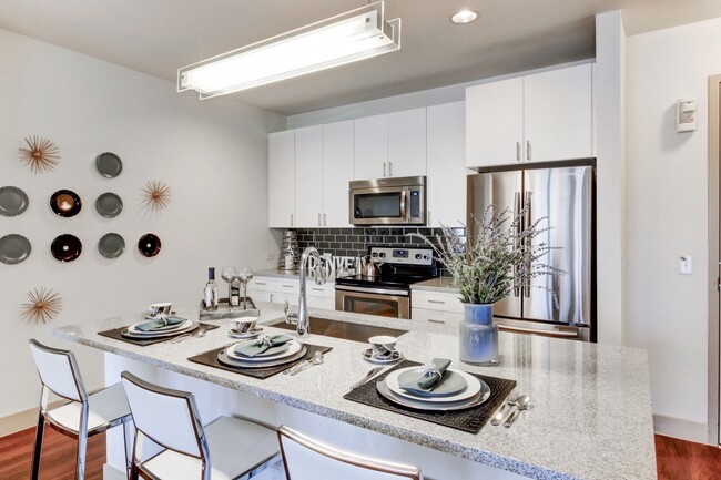 Classic model home kitchen. - Griffis at Fiddler's Green Apartments