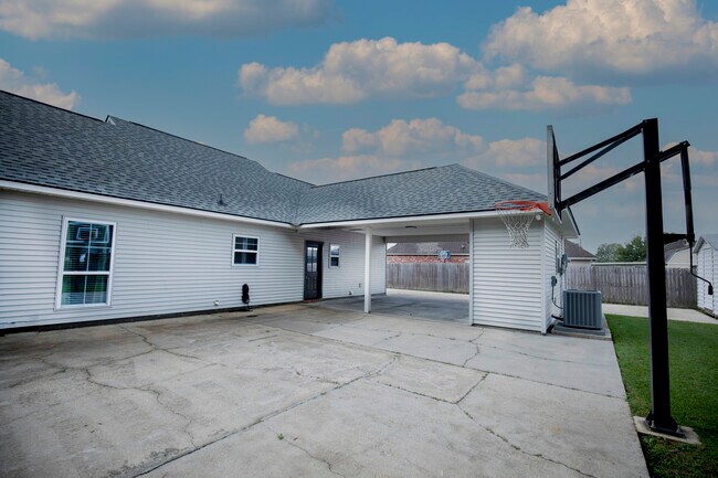Covered parking with detached storage shed