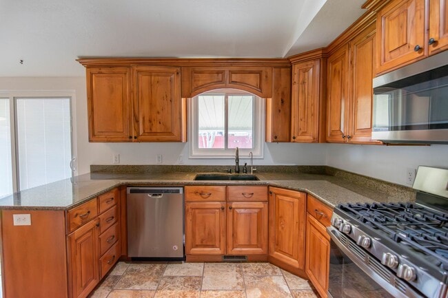 Photo - Charming 3-Bedroom Home with Spacious Fenced Yard in Prime Location