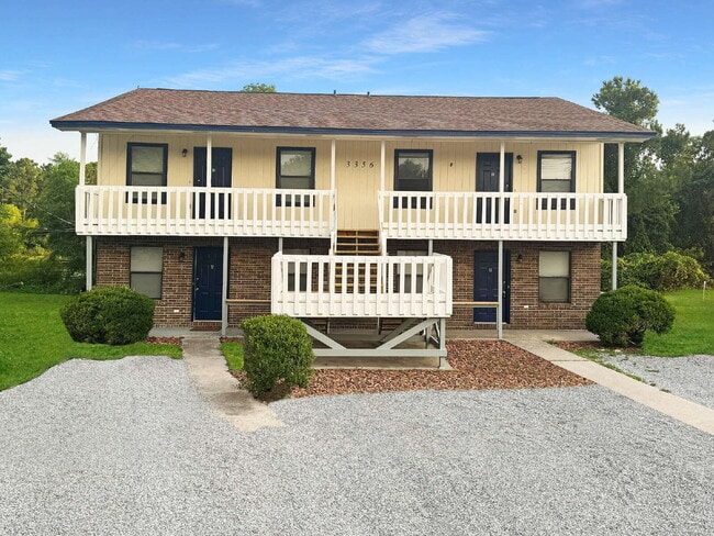 Building Photo - Renovated 2BR Coastal Apartment in Gulf Br... Unit D