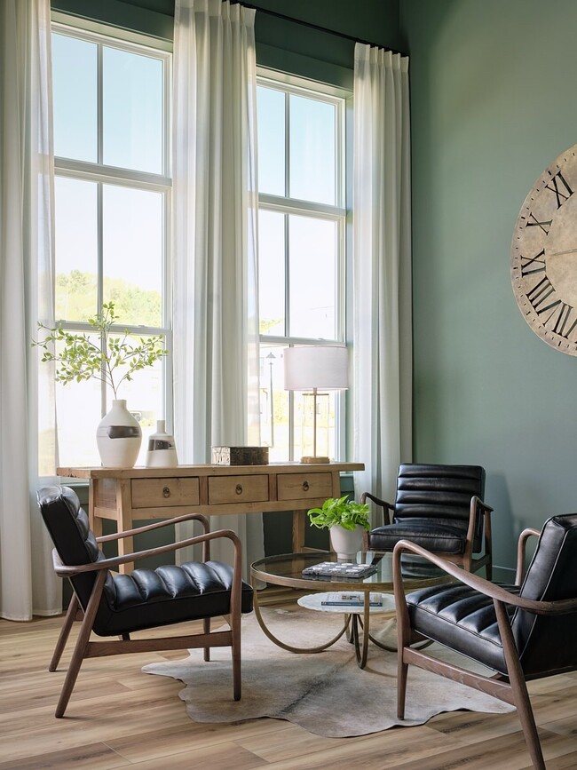 Stylish clubhouse lounging area with contemporary seating and natural light.