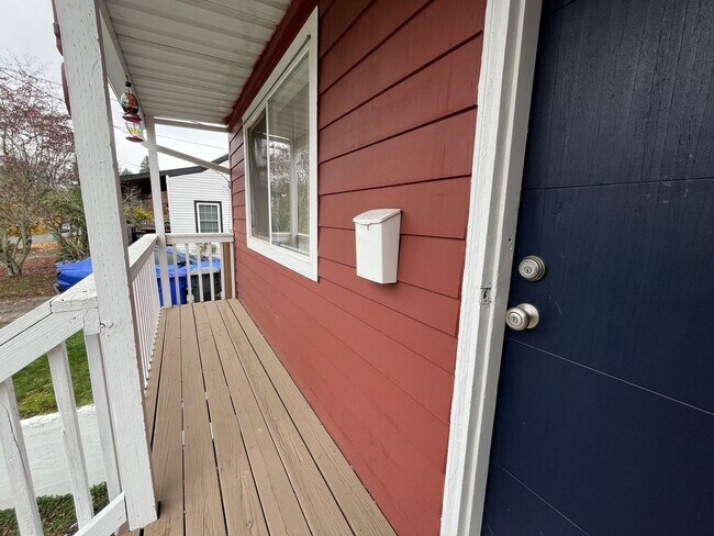Photo - Charming 2-Bedroom Home with Hardwood Floors, Bright Living Spaces & Large Fenced Yard