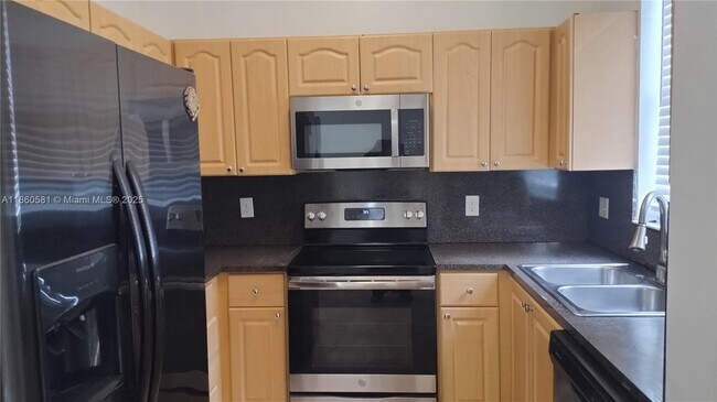 Photo - 7965 W 33rd Ln Townhome