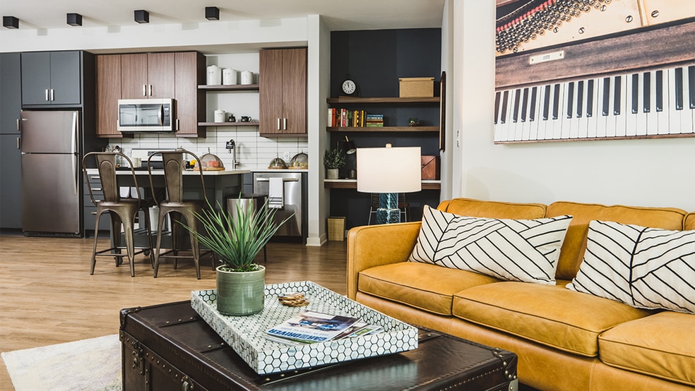 Gorgeous apartment homes with two-toned cabinetry, stainless steel appliances, and built-in work from home desk