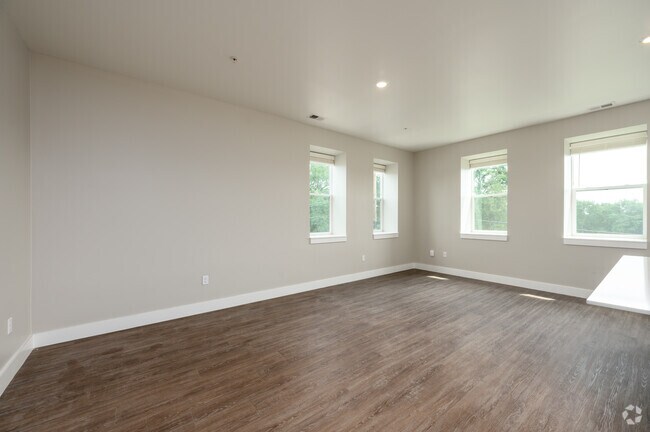 2BR, 2.5BA - 1,561SF - Living Room - The Assumption on Blaine Apartments