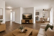 Spacious living and dining area with modern furnishings, a dedicated entertainment space, and room to gather comfortably.