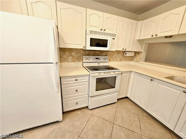 Photo - 3001 Sandpiper Bay Cir Unit B202