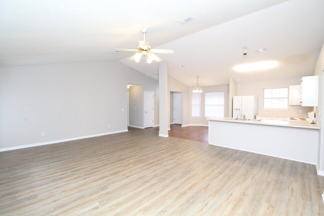 Photo - 3BR/2BA Brick Home with Vaulted Ceilings, Open Living Areas, 2-Car Garage & Fenced Backyard Near ...