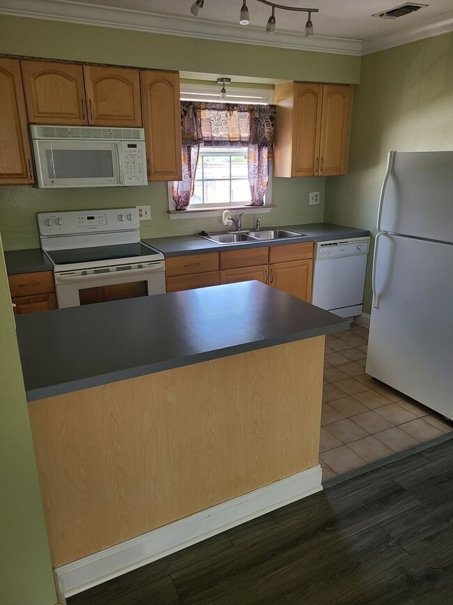 Photo - 1.1 New laminate flooring - looks amazing- Community Pool and Laundry facility