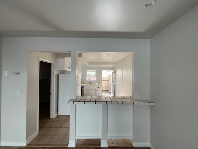 Unit B - Kitchen, opens to Patio - 2411 Harriman Ln