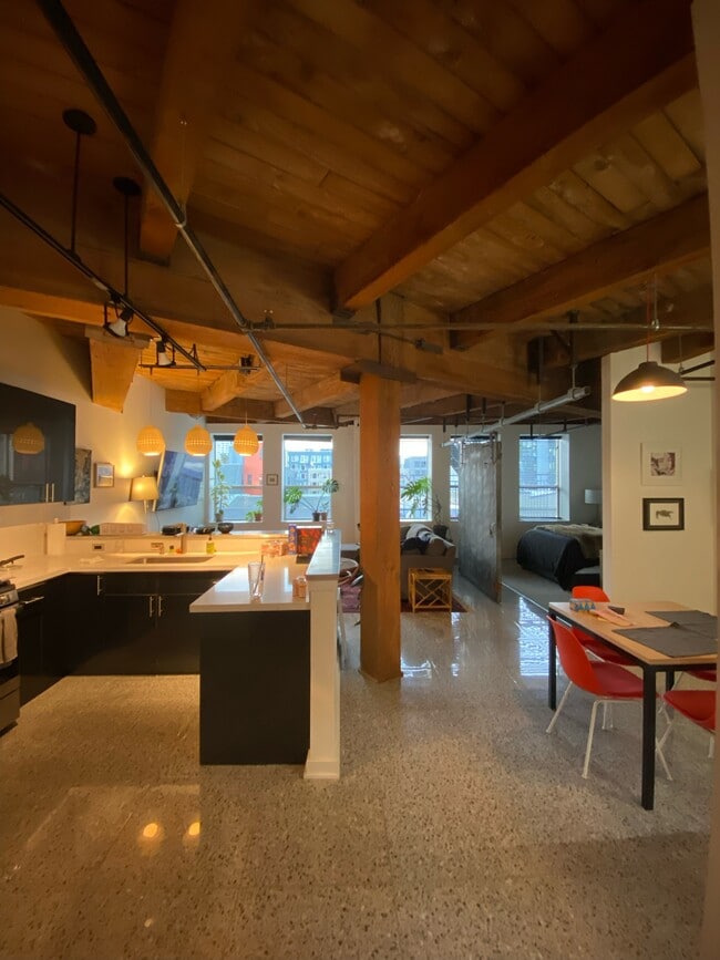 Kitchen area to left, dining area to right with patio - 1408 12th Ave Unit 204