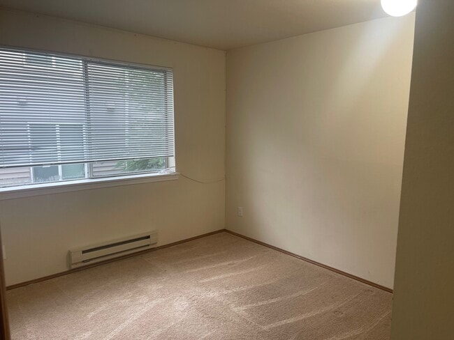 Building Photo - 8820 Stone Ave N Unit 201