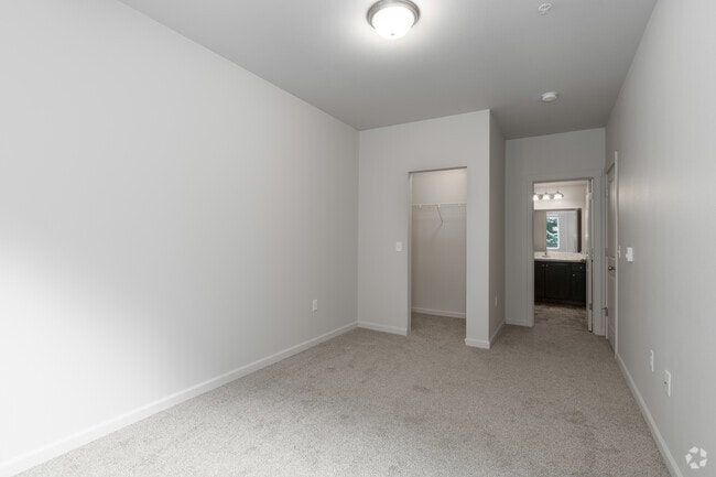 2BR, 2BA - 983SF - Primary Bedroom - Trillium Woods Apartments