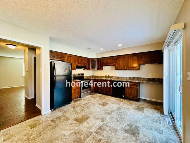 Photo - Beautiful Overland Park Townhome w/ Wood Floors, Large Open Kitchen and a Community Pool!