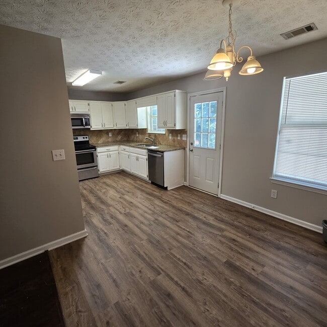 Photo - "Charming 4-Bed Oasis with Granite Countertops on Pebble Creek Drive, McDonough!"