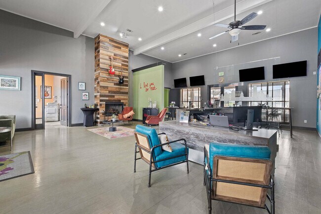 Stylish Community Lounge with Fireplace at Ovation Apartments in Austin, TX