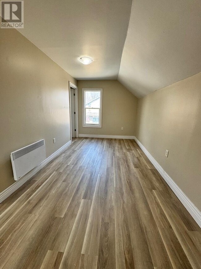 Photo - 1 Bedroom Upper-Level Unit – Laundry Hooku... Unit B