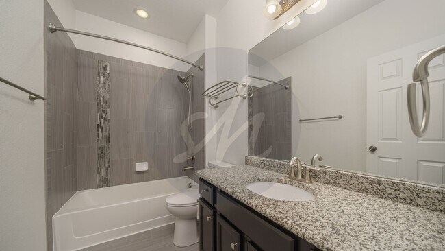 Photo - Spacious 4-Bedroom Home with Bonus Room and Full Basement!