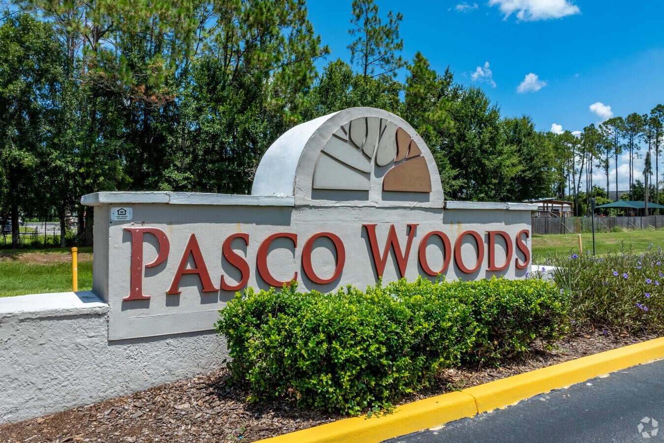 Entrance Sign - Pasco Woods Apartments