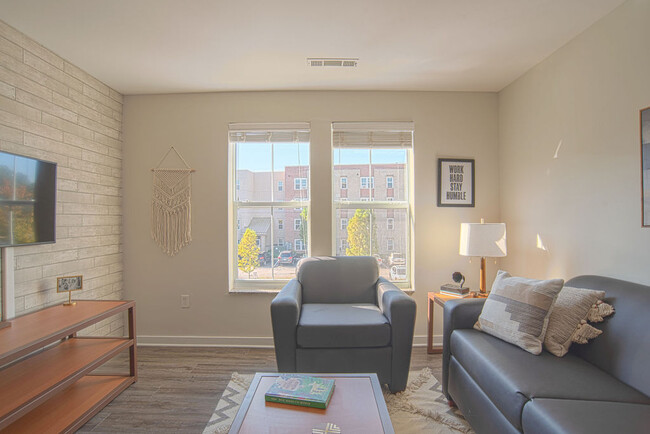 Bright living room area. Furnished options available.