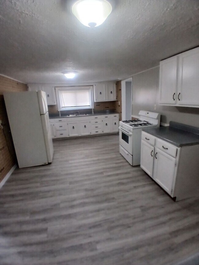 Photo - Completely Renovated 3 Bedroom, 2 Full Bathrooms! Front Porch & Detached Garage! 2 Living Rooms!