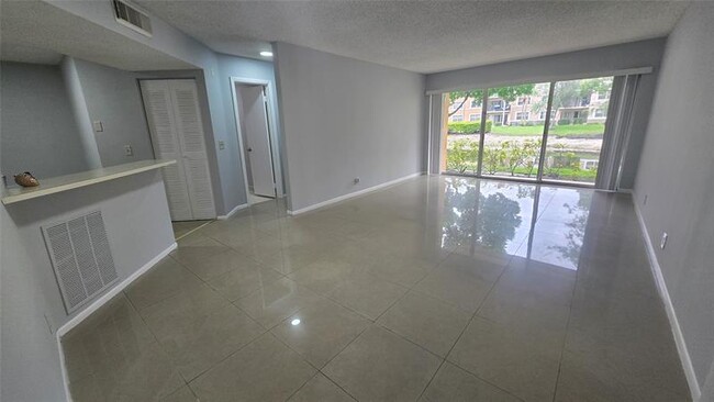 Building Photo - 9055 Wiles Rd Unit 5-106 Rental