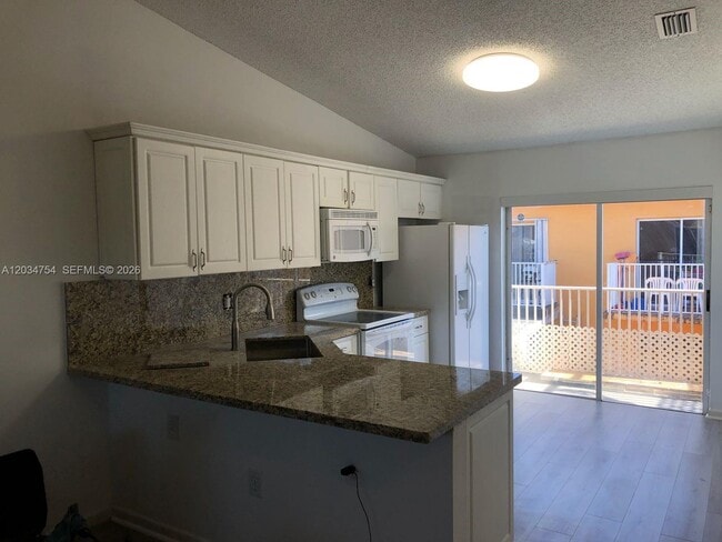 Building Photo - 7730 W 34th Ln Unit 14-202
