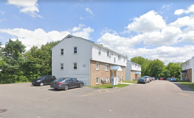 119 Main Street 4A outside, with covered front entrance. Tenants are guaranteed one parking spot next to unit, and spot(s) in the rear of association lot. - 119 Main St Apartment Unit 4A