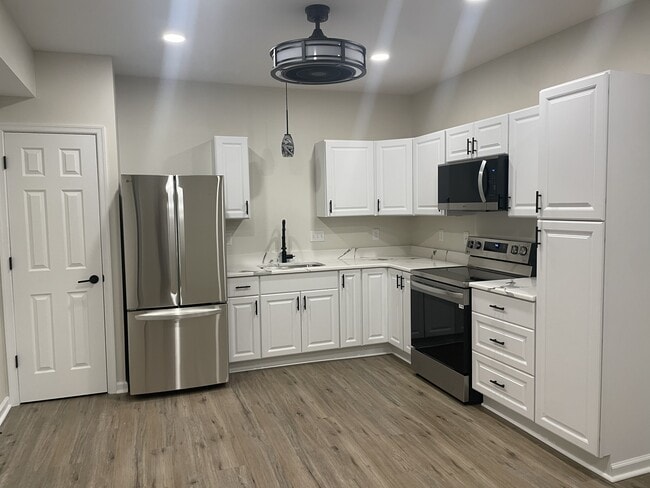 Building Photo - 2115 Harrison Ave Unit #1