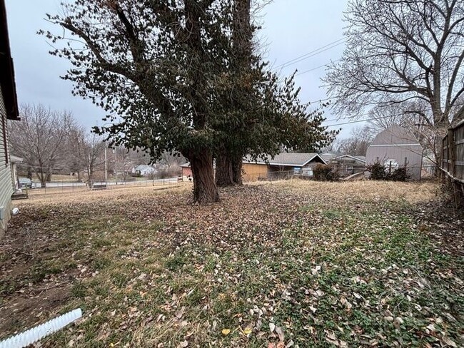 Photo - Charming 4BR 1BA Home with spacious yard!