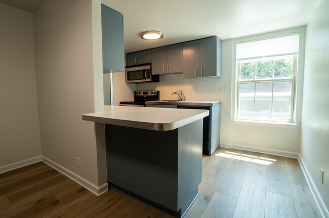 Cozy kitchen and dining area with room for bar stools. - 300 Crockett St Unit Apt 214