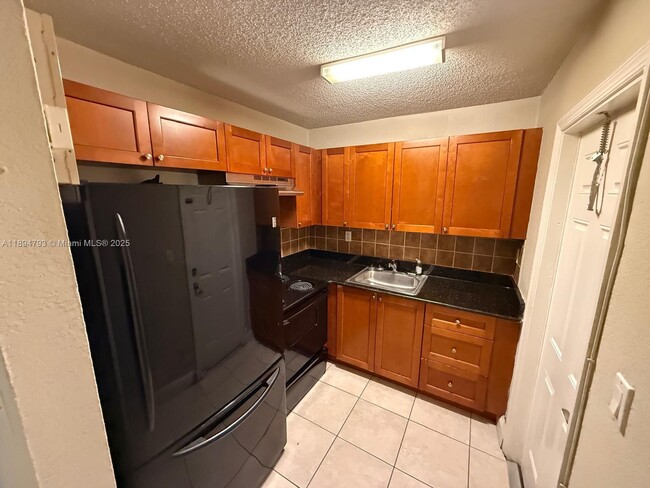 Building Photo - 4251 NW 5th St Unit 114