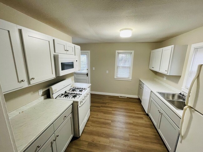 Photo - Fall 2024 remodel! Brand new cabinets, countertops, vanity etc!